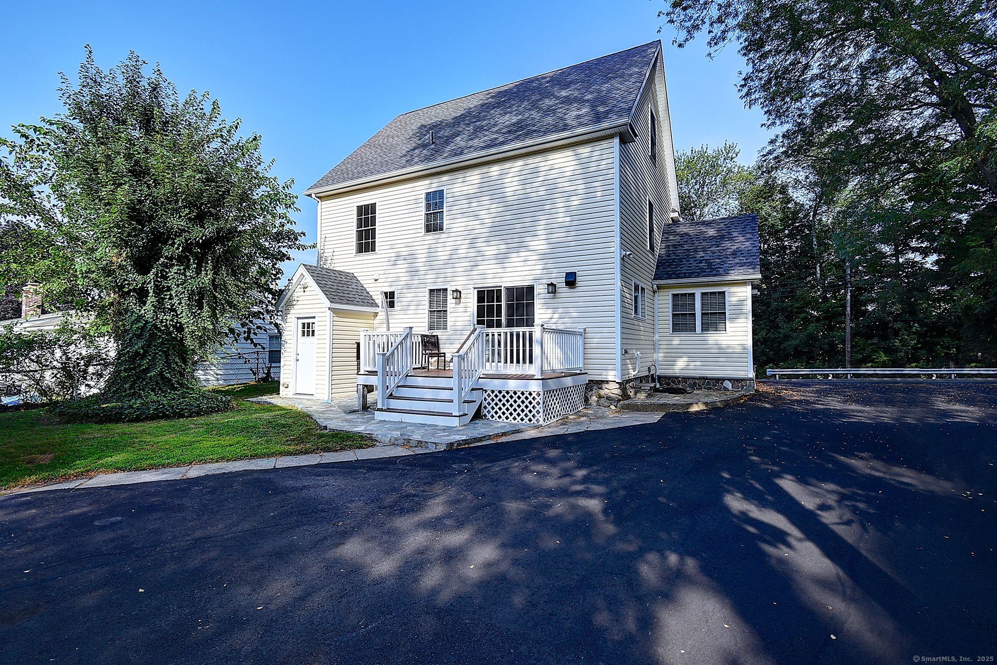 631 High Street Naugatuck, CT 06770 - Photo 4 of 36 a view of a house with backyard and trees