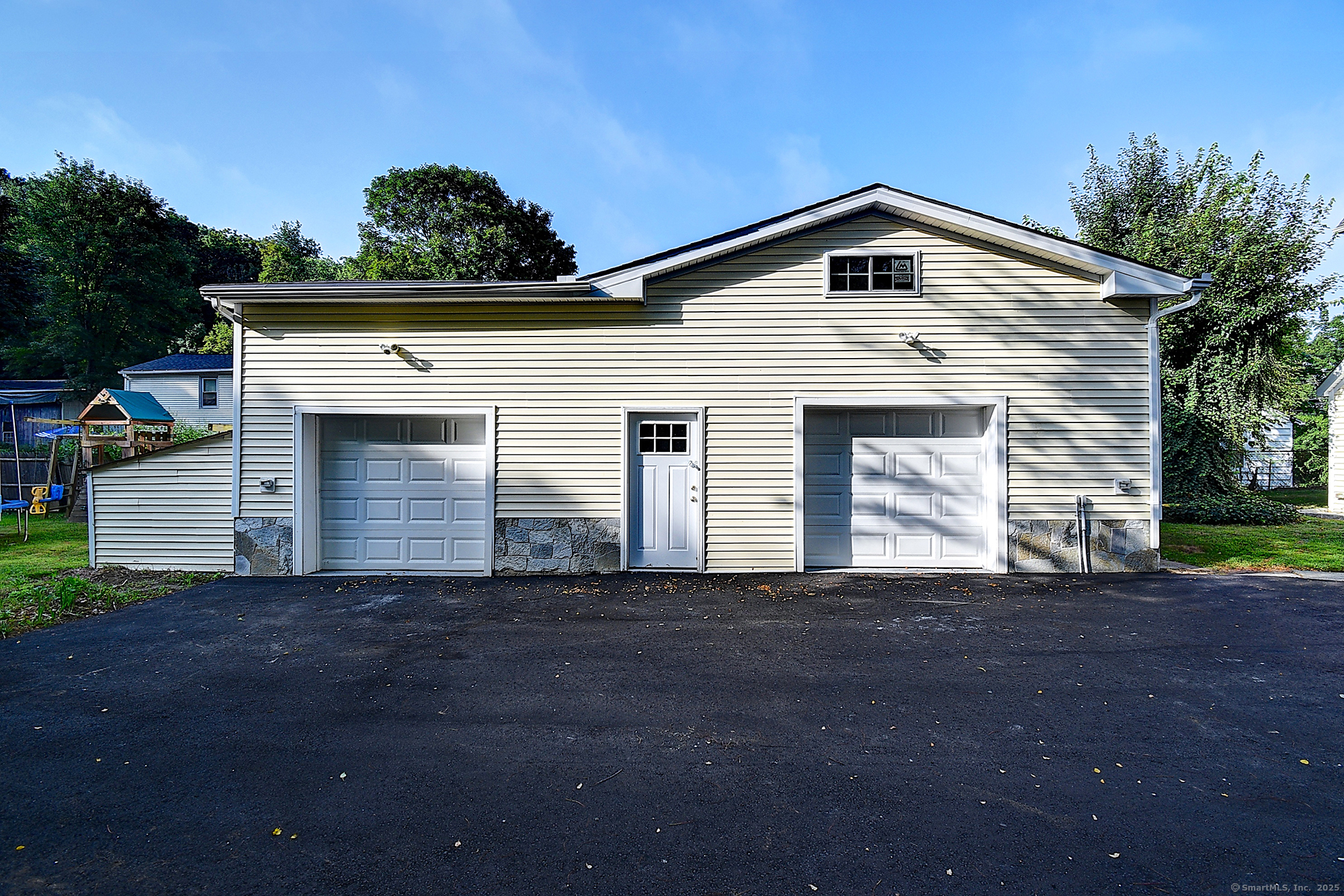 631 High Street Naugatuck, CT 06770 - Photo 5 of 36 a front view of a house with garage