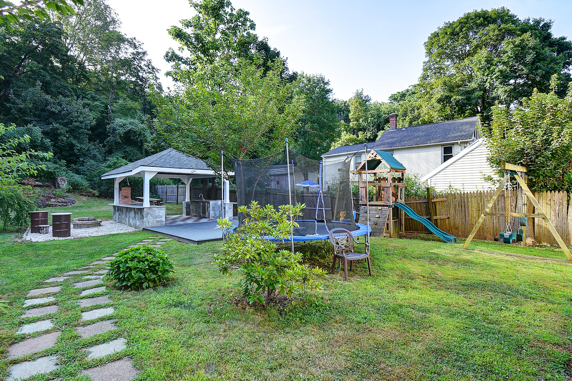 631 High Street Naugatuck, CT 06770 - Photo 6 of 36 a view of a house with backyard sitting area and garden