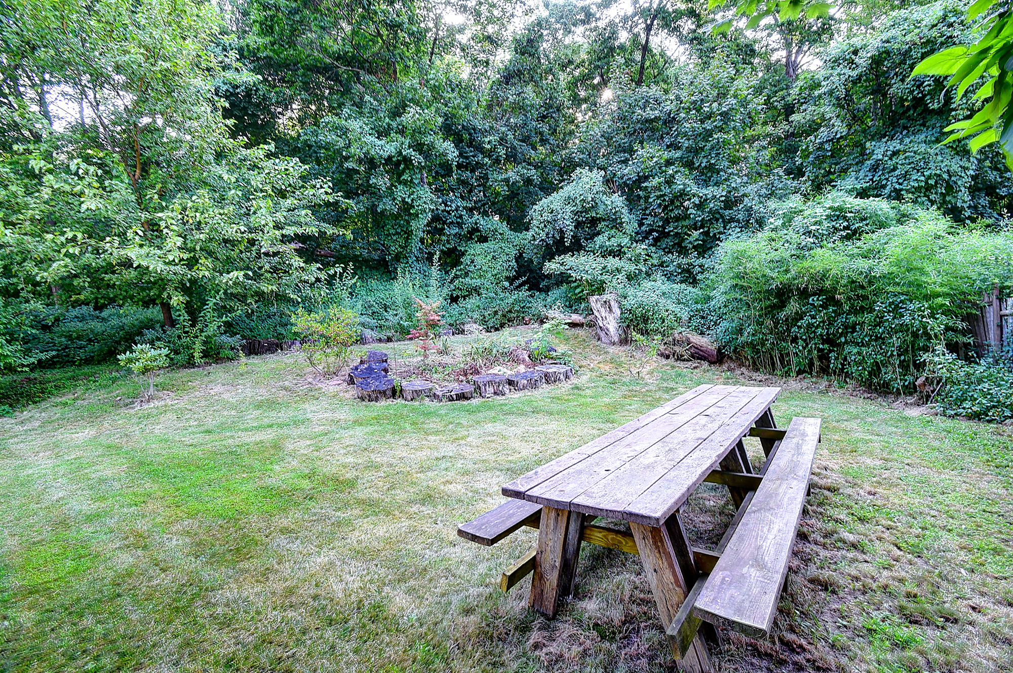 631 High Street Naugatuck, CT 06770 - Photo 9 of 36 a backyard of a house with table and chairs