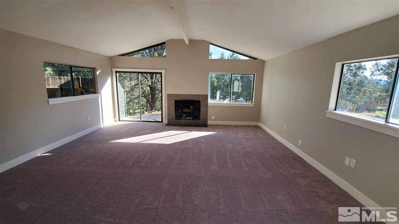 2421 Grizzley Road Reno, NV 89521 - Photo 7 of 13 a view of empty room with a fireplace