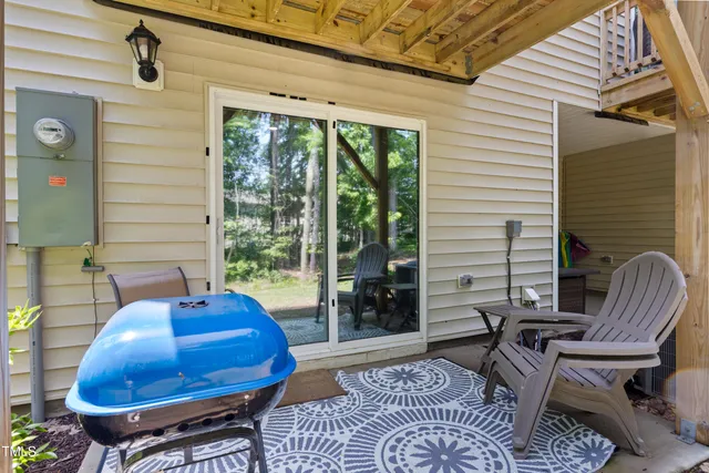 a balcony with furniture and a potted plant