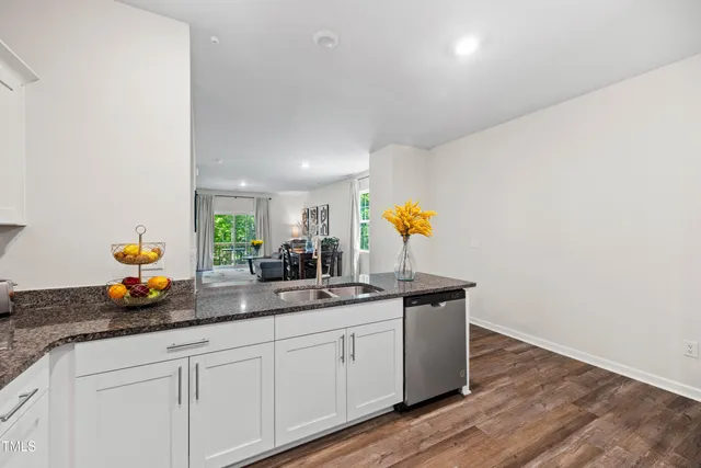 a kitchen with sink and window