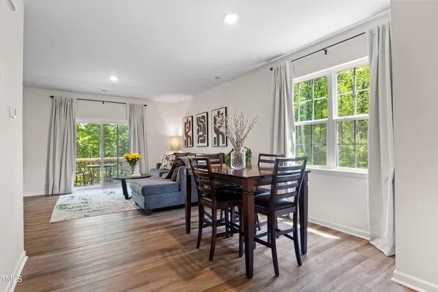 a view of a livingroom with furniture window and wooden floor