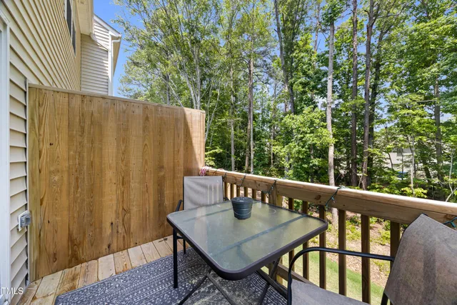 a view of balcony with furniture and wooden deck