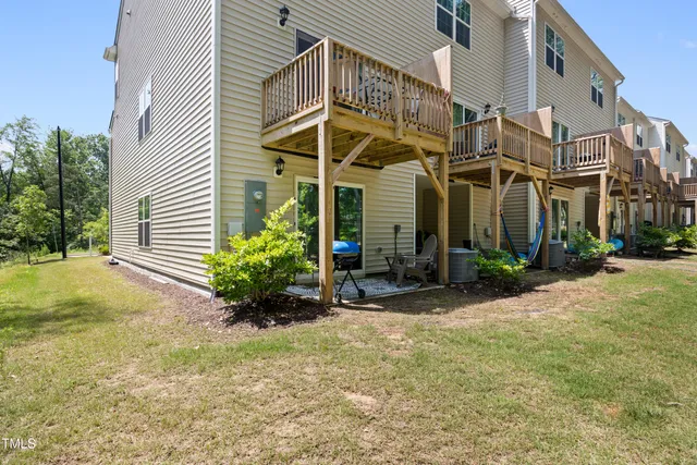 a view of a house with potted plants