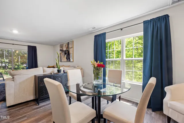a view of a dining room with furniture window and outside view