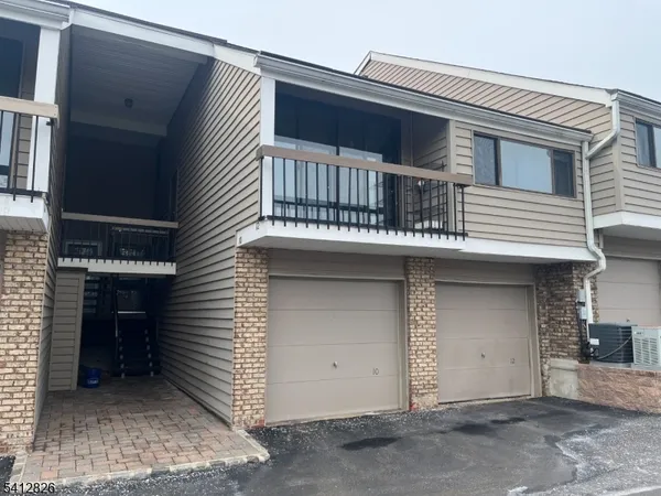 a view of a house with a garage