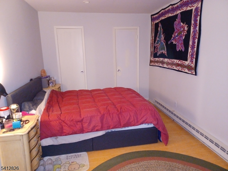 12 North Slope Clinton, NJ 08809 - Photo 5 of 7 a bedroom with a bed and closet