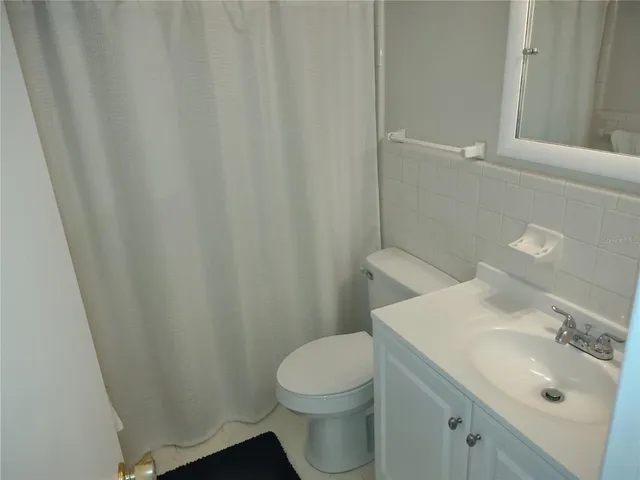 a bathroom with a sink and toilet