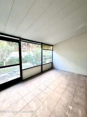 a view of an empty room with a large window