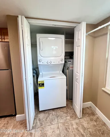 a view of a storage & utility room with washer and dryer