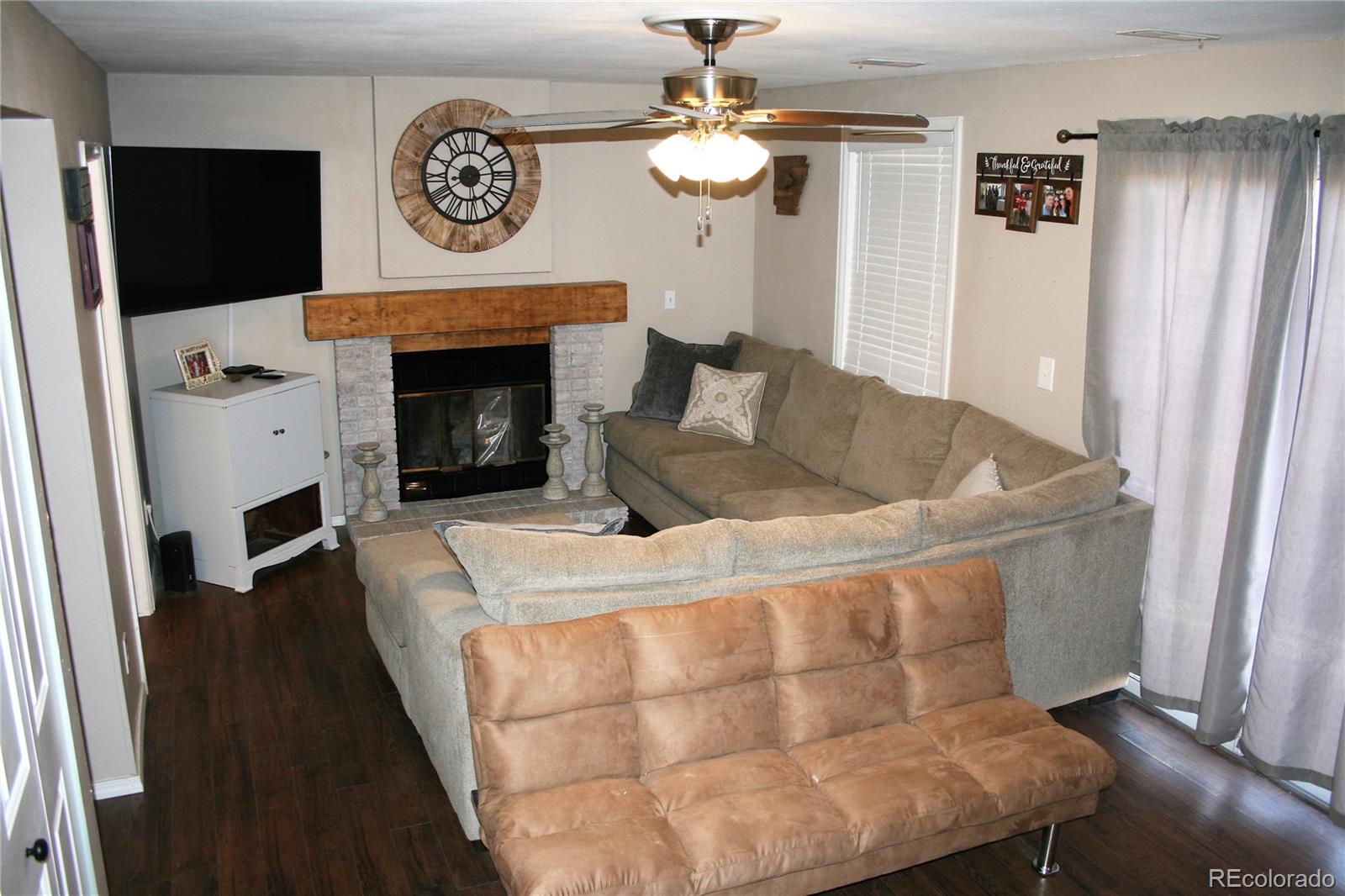 4415 Fenton Road Colorado Springs, CO 80916 - Photo 8 of 25 a living room with furniture and a fireplace