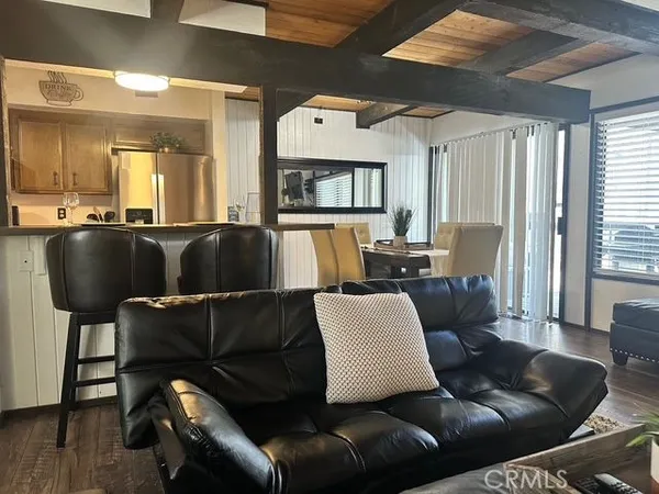a living room with a couch and a rug