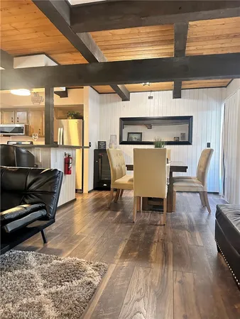 a living room with furniture and large windows
