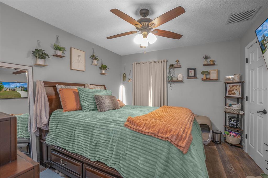 5466 West Tortuga Loop Lecanto, FL 34461 - Photo 23 of 41 a bedroom with a bed and a flat screen tv