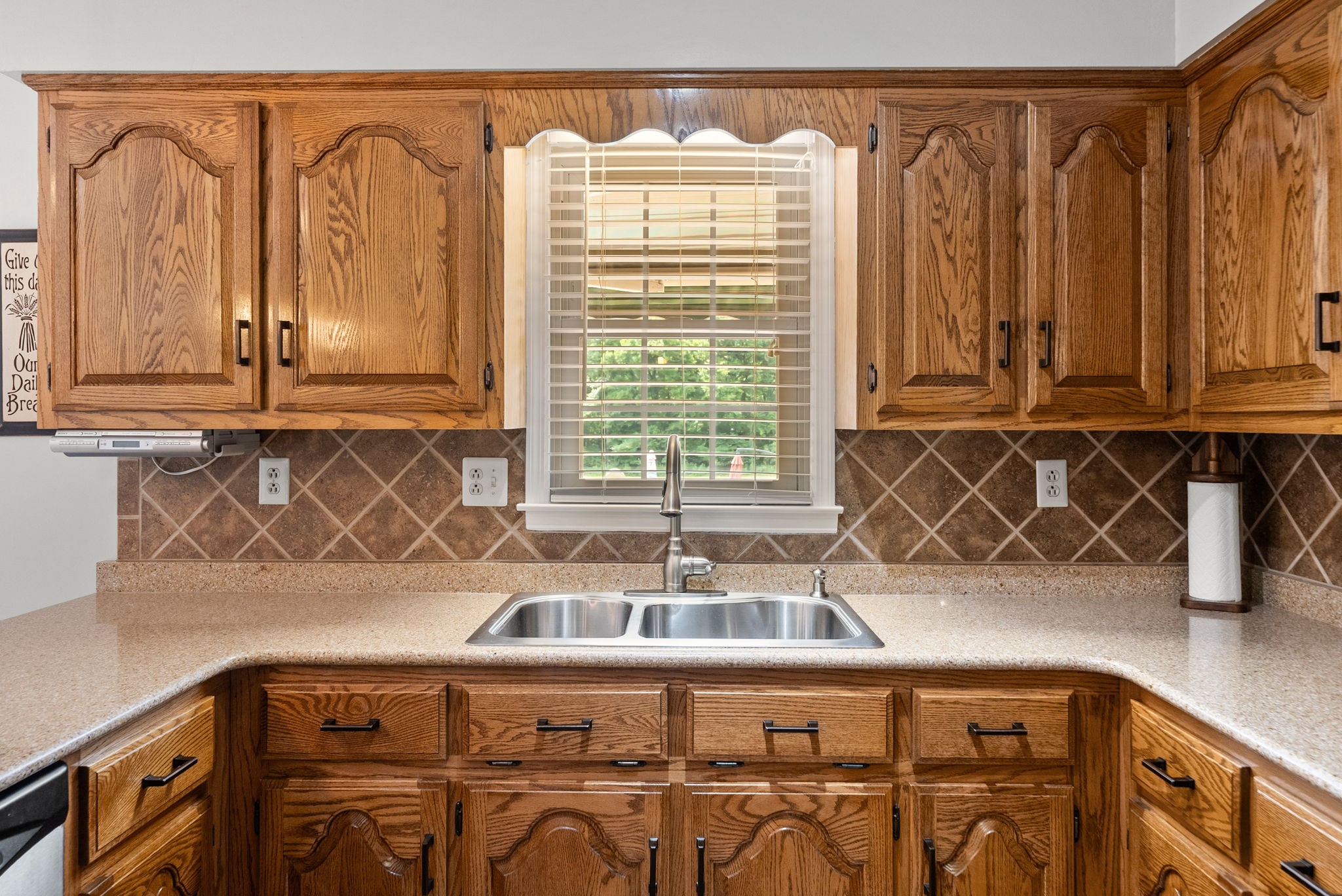 915 Rocky Hollow Road Erin, TN 37061 - Photo 15 of 49 a kitchen with a cabinets a sink and a wooden floor