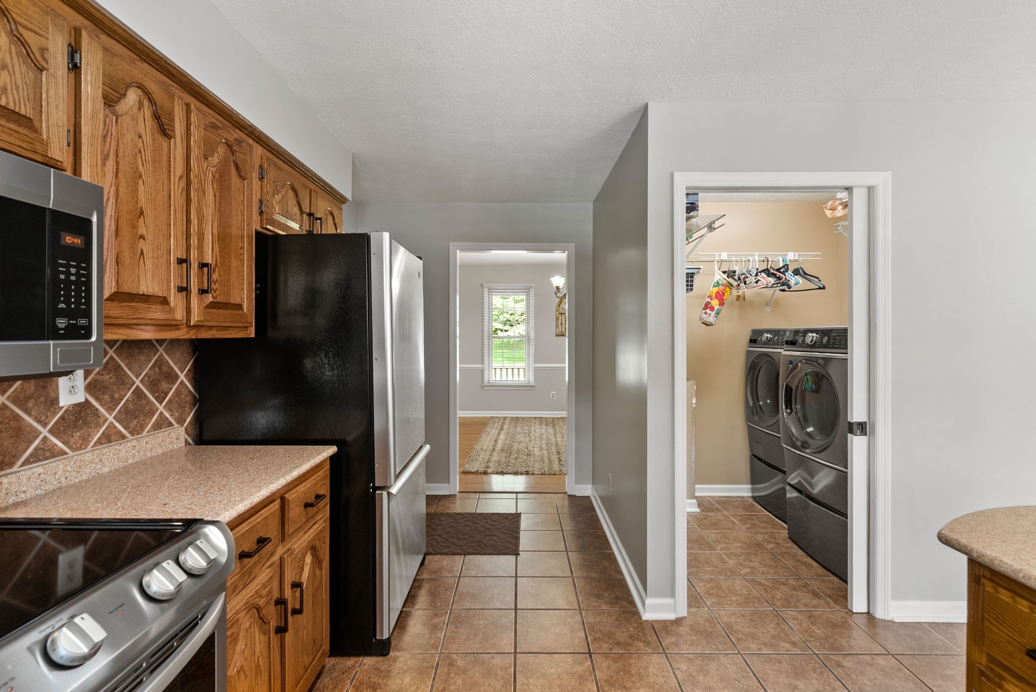 915 Rocky Hollow Road Erin, TN 37061 - Photo 16 of 49 a kitchen with a refrigerator and a sink