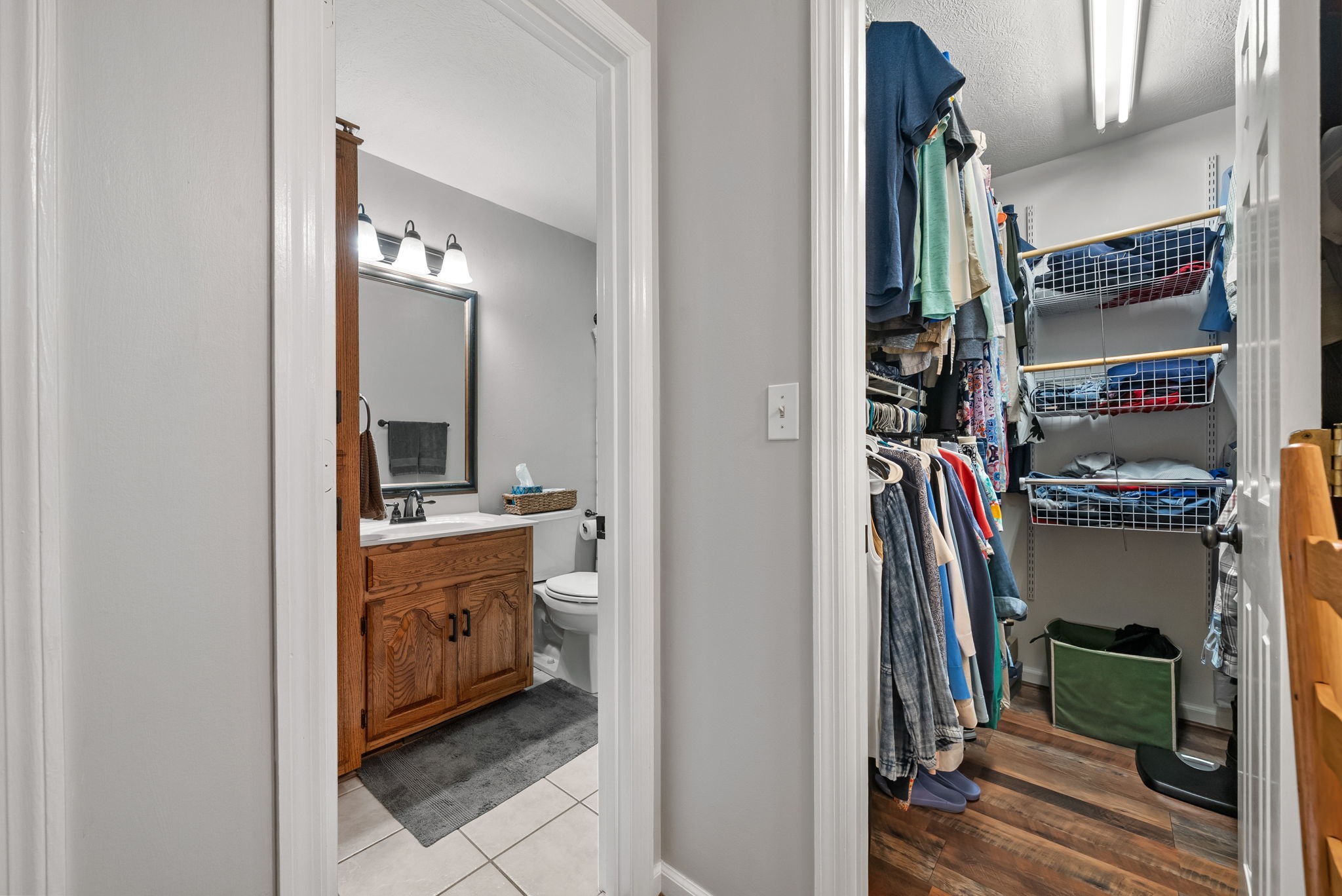 915 Rocky Hollow Road Erin, TN 37061 - Photo 19 of 49 a view of walk in closet with clothes and shoes