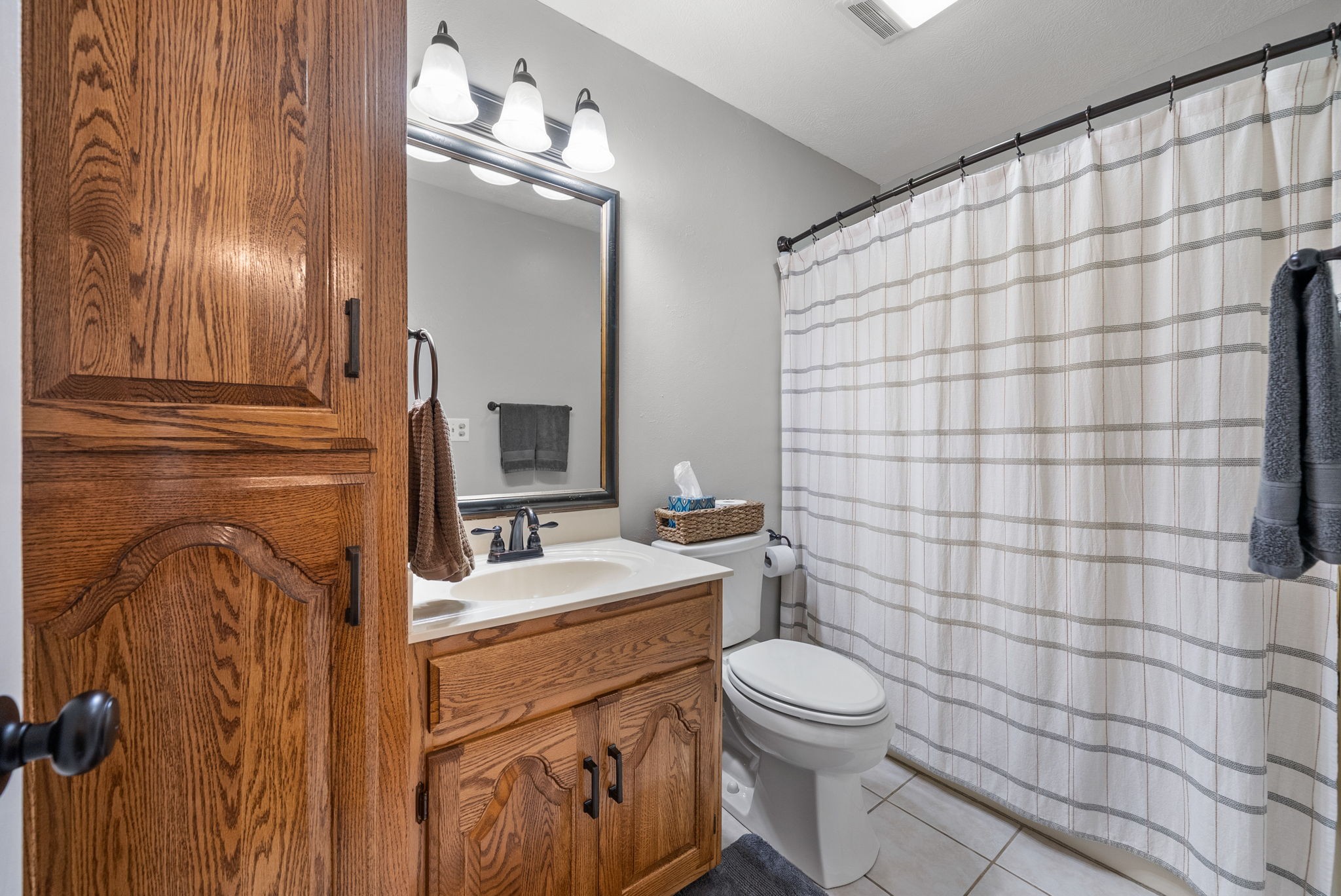 915 Rocky Hollow Road Erin, TN 37061 - Photo 20 of 49 a bathroom with a sink toilet and shower