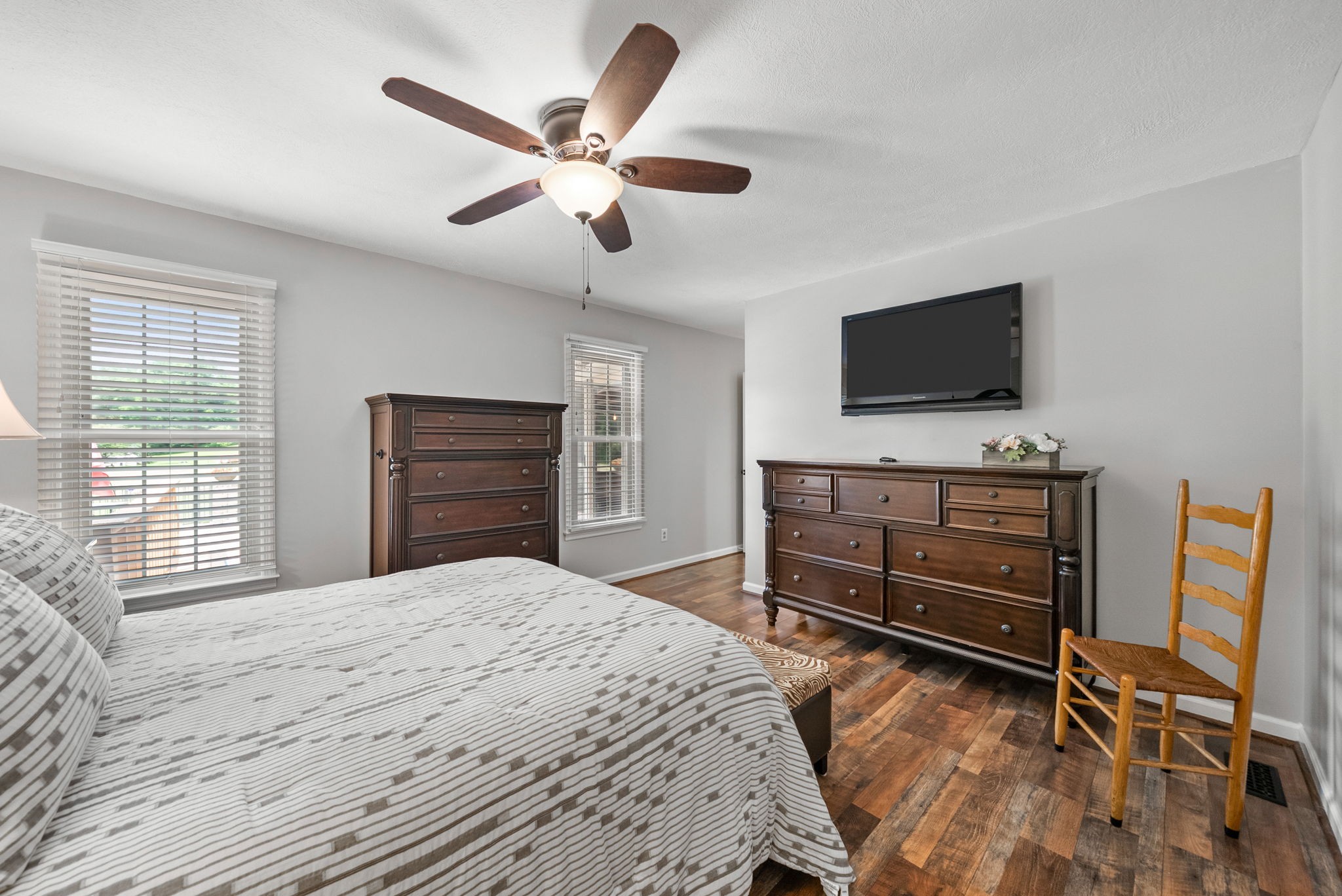 915 Rocky Hollow Road Erin, TN 37061 - Photo 23 of 49 a bedroom with a bed and a flat screen tv