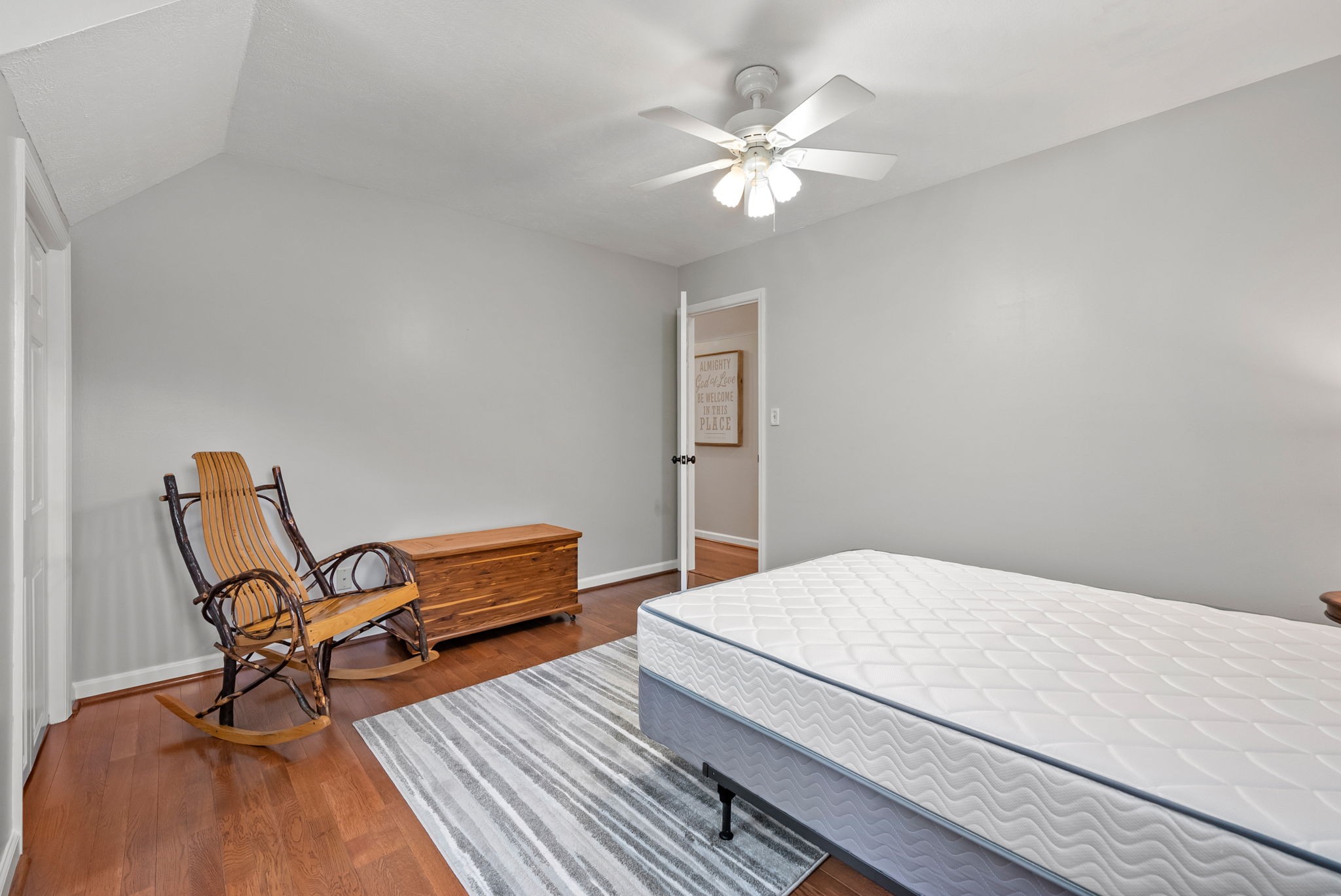 915 Rocky Hollow Road Erin, TN 37061 - Photo 26 of 49 a bedroom with a bed and a chandelier