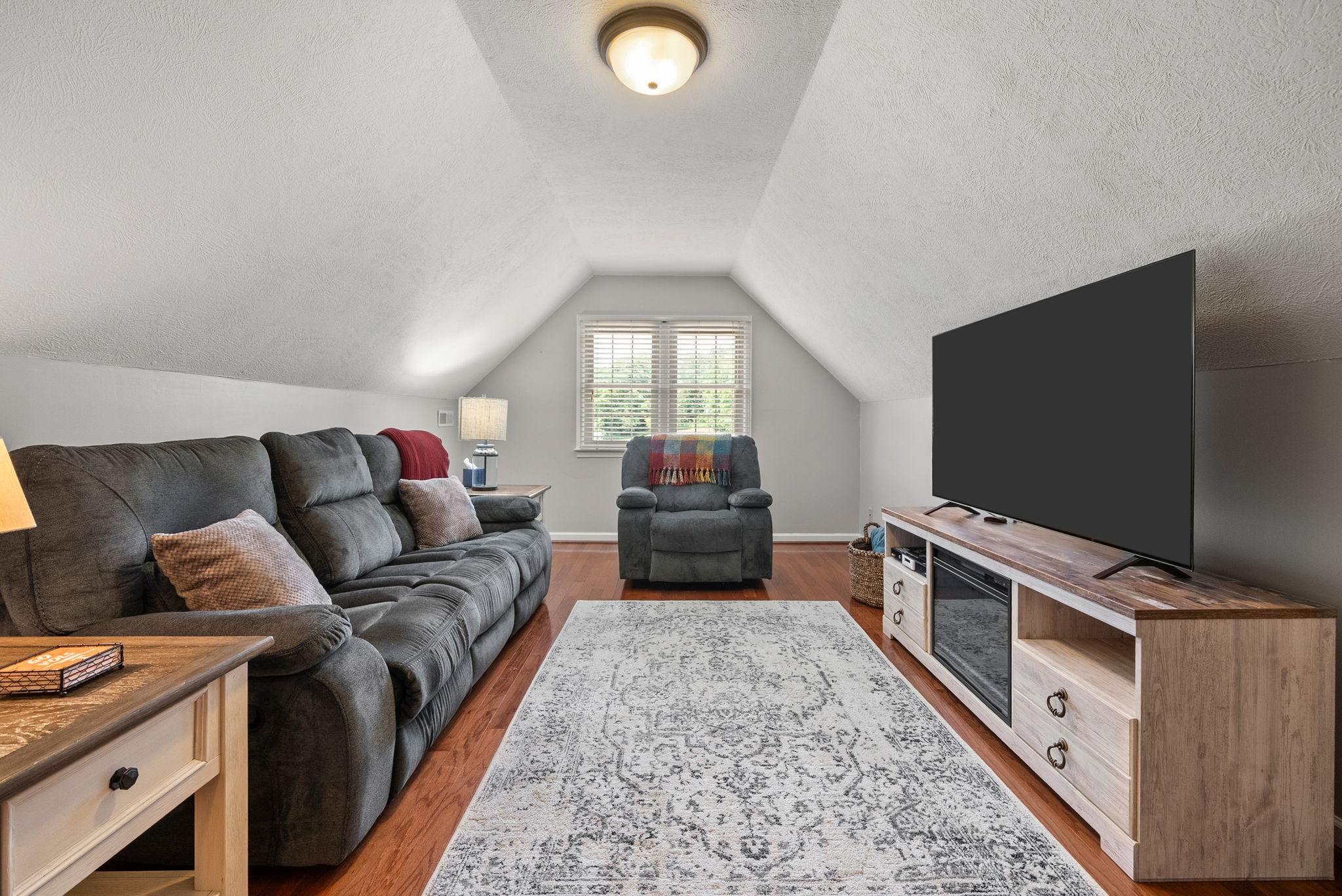 915 Rocky Hollow Road Erin, TN 37061 - Photo 28 of 49 a living room with furniture and a flat screen tv