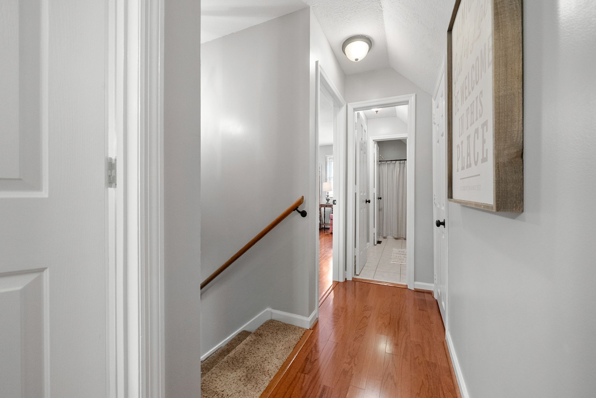 915 Rocky Hollow Road Erin, TN 37061 - Photo 30 of 49 a view of a hallway with wooden floor and staircase