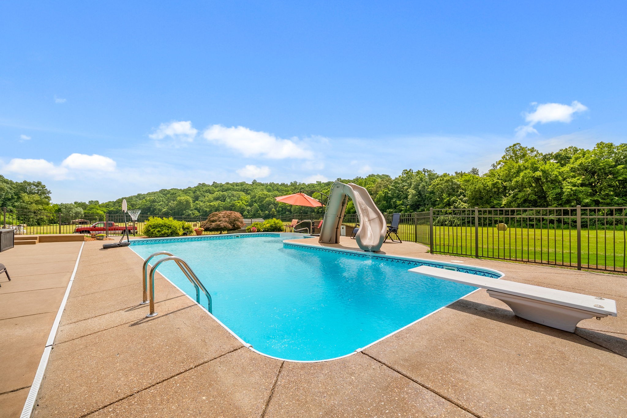 915 Rocky Hollow Road Erin, TN 37061 - Photo 34 of 49 a view of a swimming pool with a patio and a yard