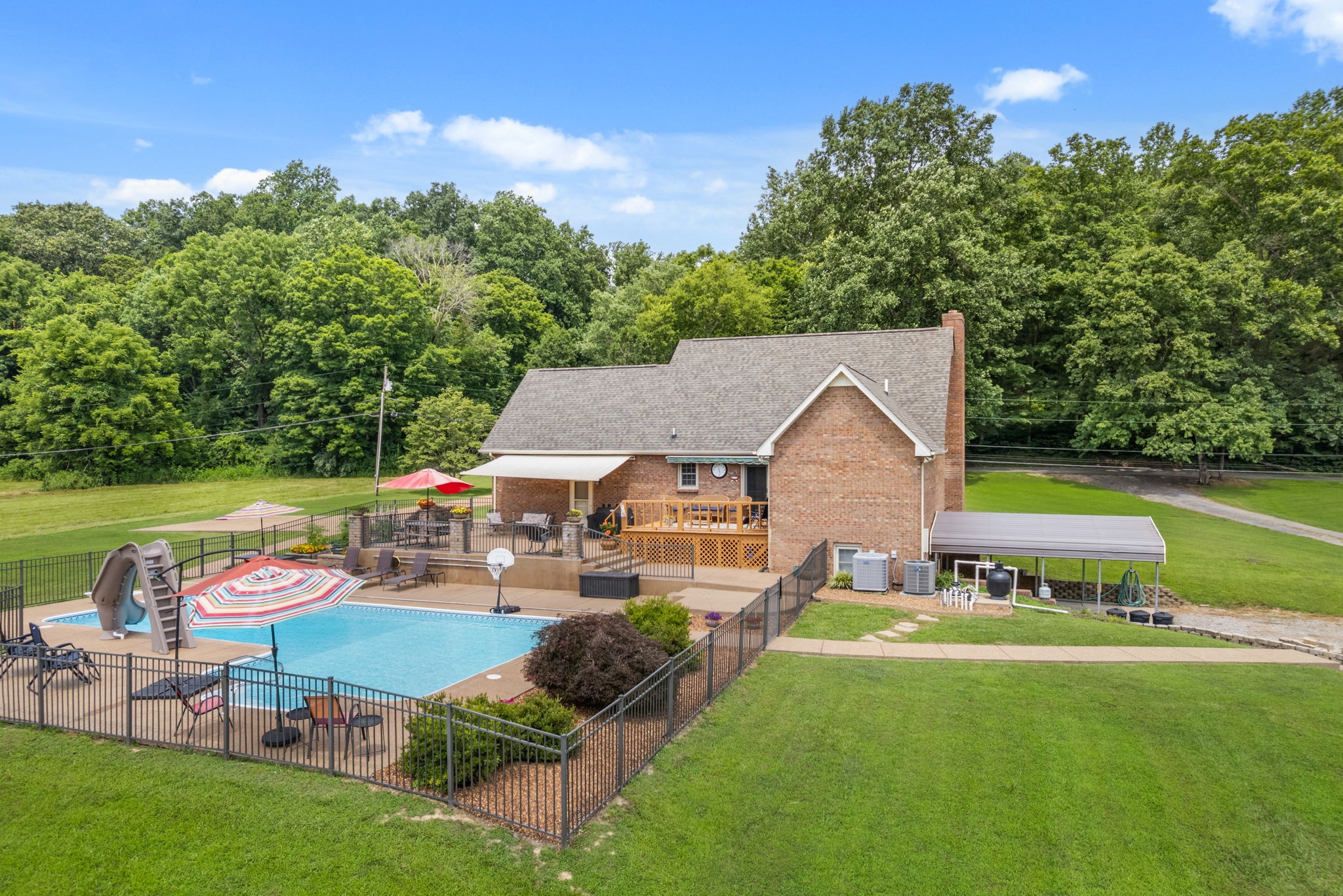 915 Rocky Hollow Road Erin, TN 37061 - Photo 42 of 49 a aerial view of a house with swimming pool and a yard