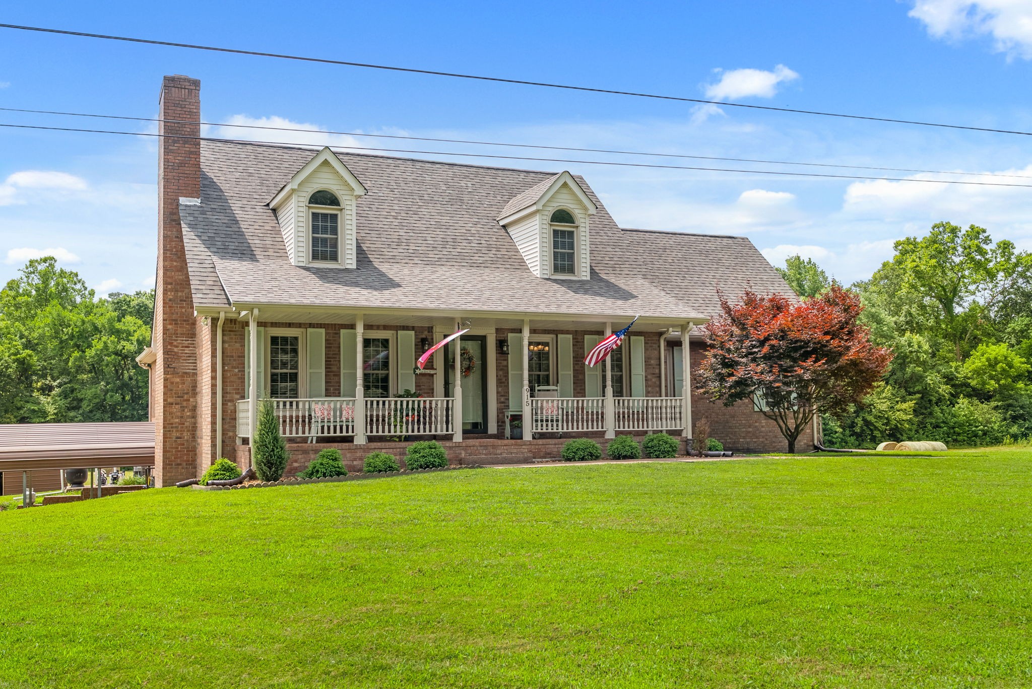 915 Rocky Hollow Road Erin, TN 37061 - Photo 5 of 49 a front view of a house with a yard