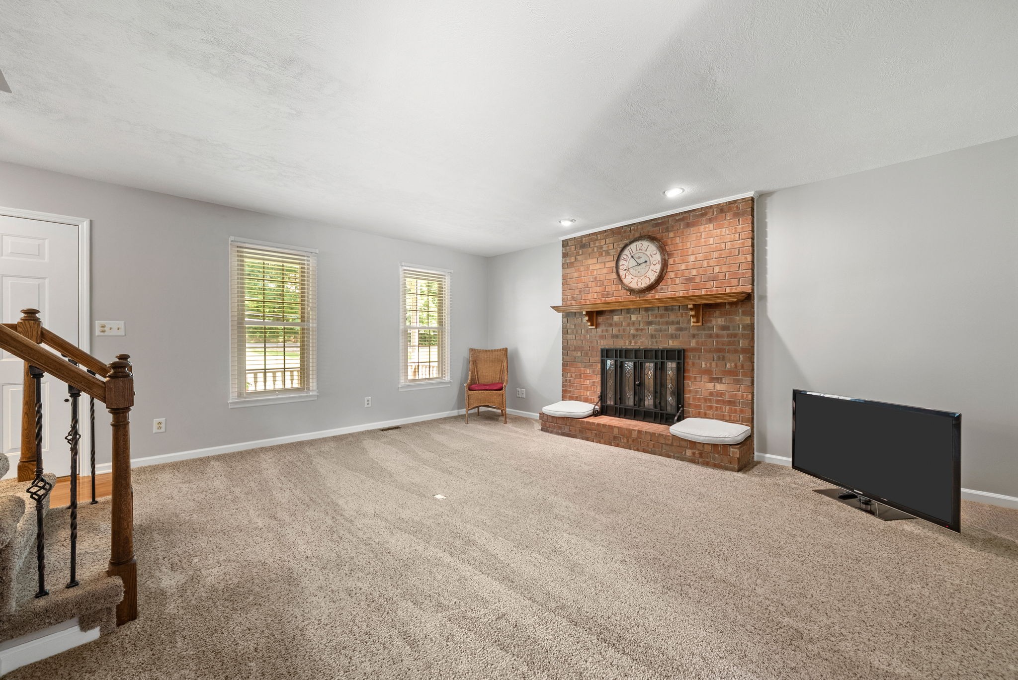 915 Rocky Hollow Road Erin, TN 37061 - Photo 9 of 49 a view of an empty room with a fireplace and a window