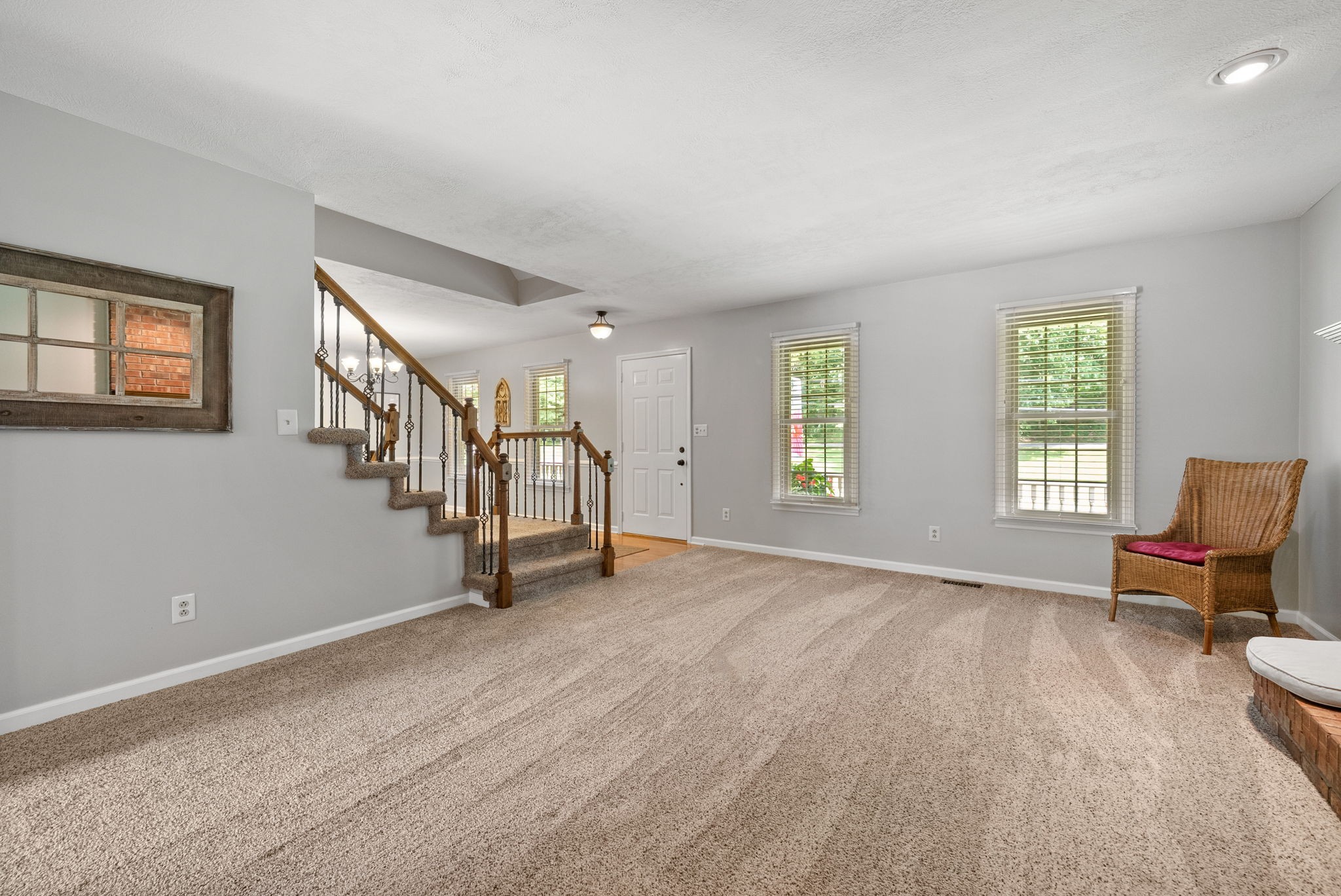 915 Rocky Hollow Road Erin, TN 37061 - Photo 10 of 49 a view of an empty room with window and stairs