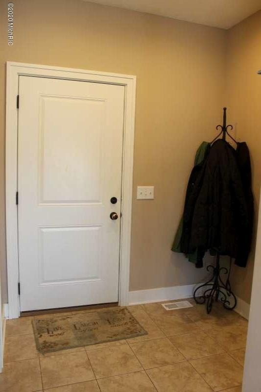 16072 Surrey Way Spring Lake, MI 49456 - Photo 17 of 34 garage entry
