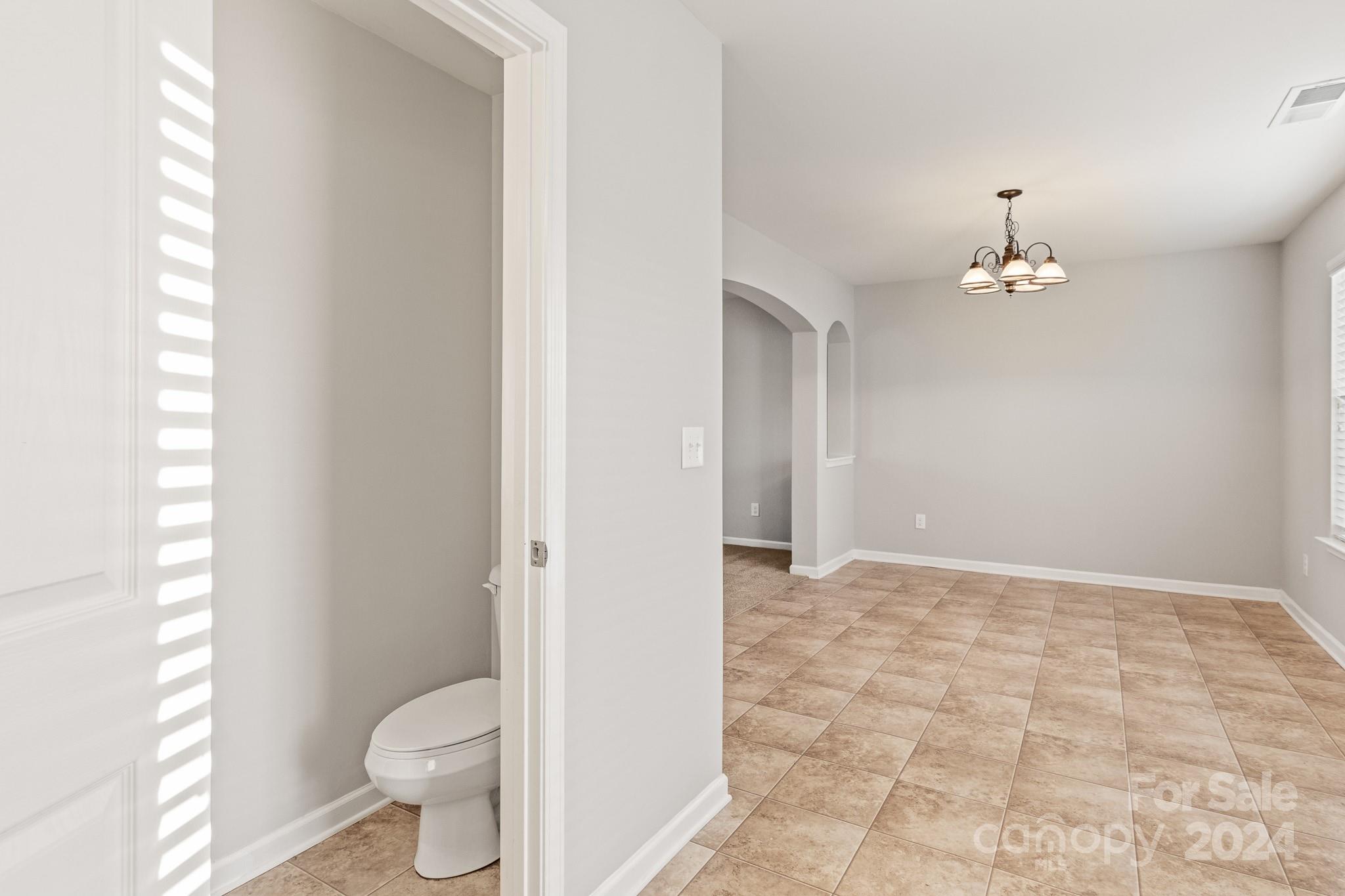 4071 Clover Road Northwest Concord, NC 28027 - Photo 19 of 43 a bathroom with a toilet