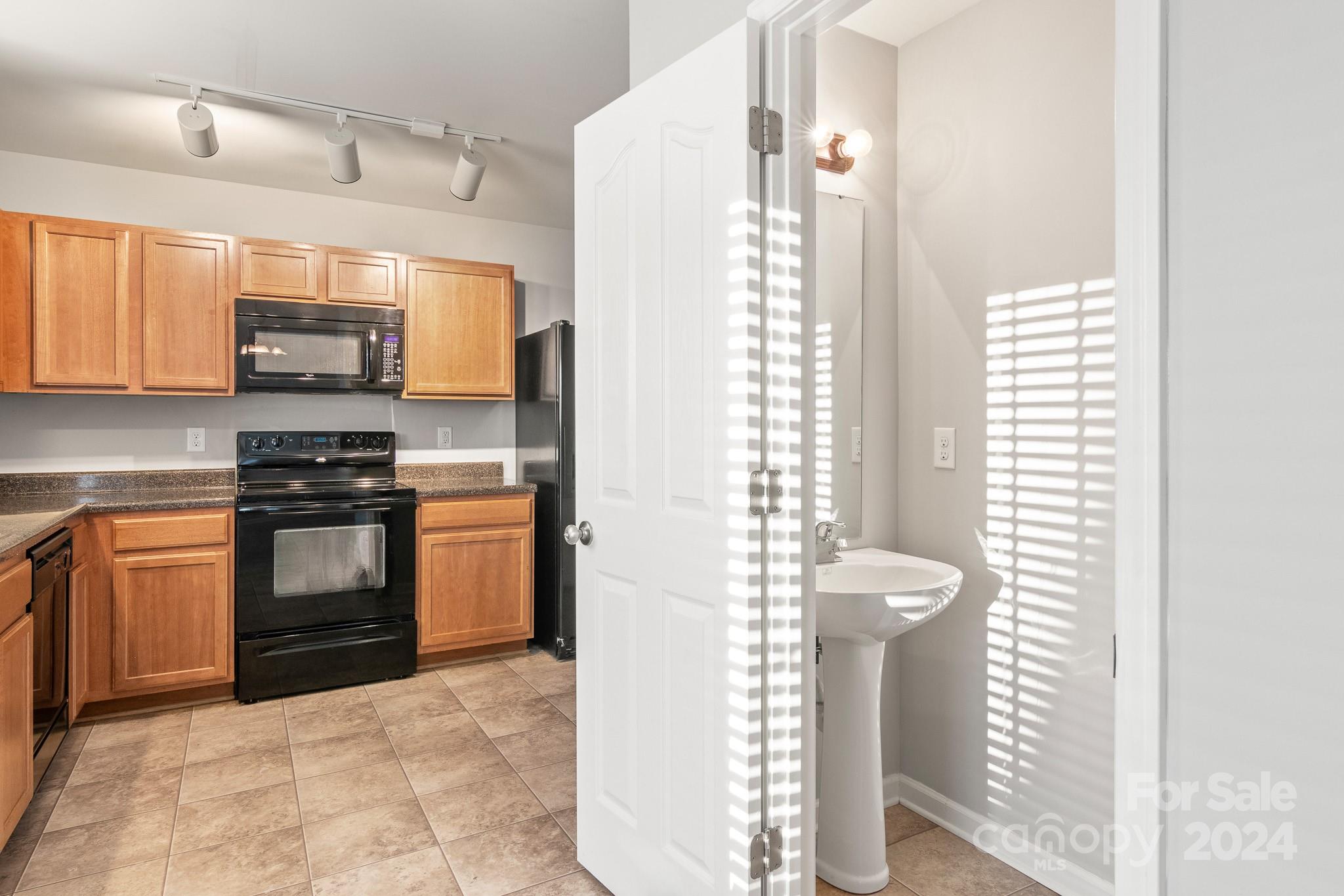 4071 Clover Road Northwest Concord, NC 28027 - Photo 20 of 43 a kitchen with granite countertop a stove and a refrigerator