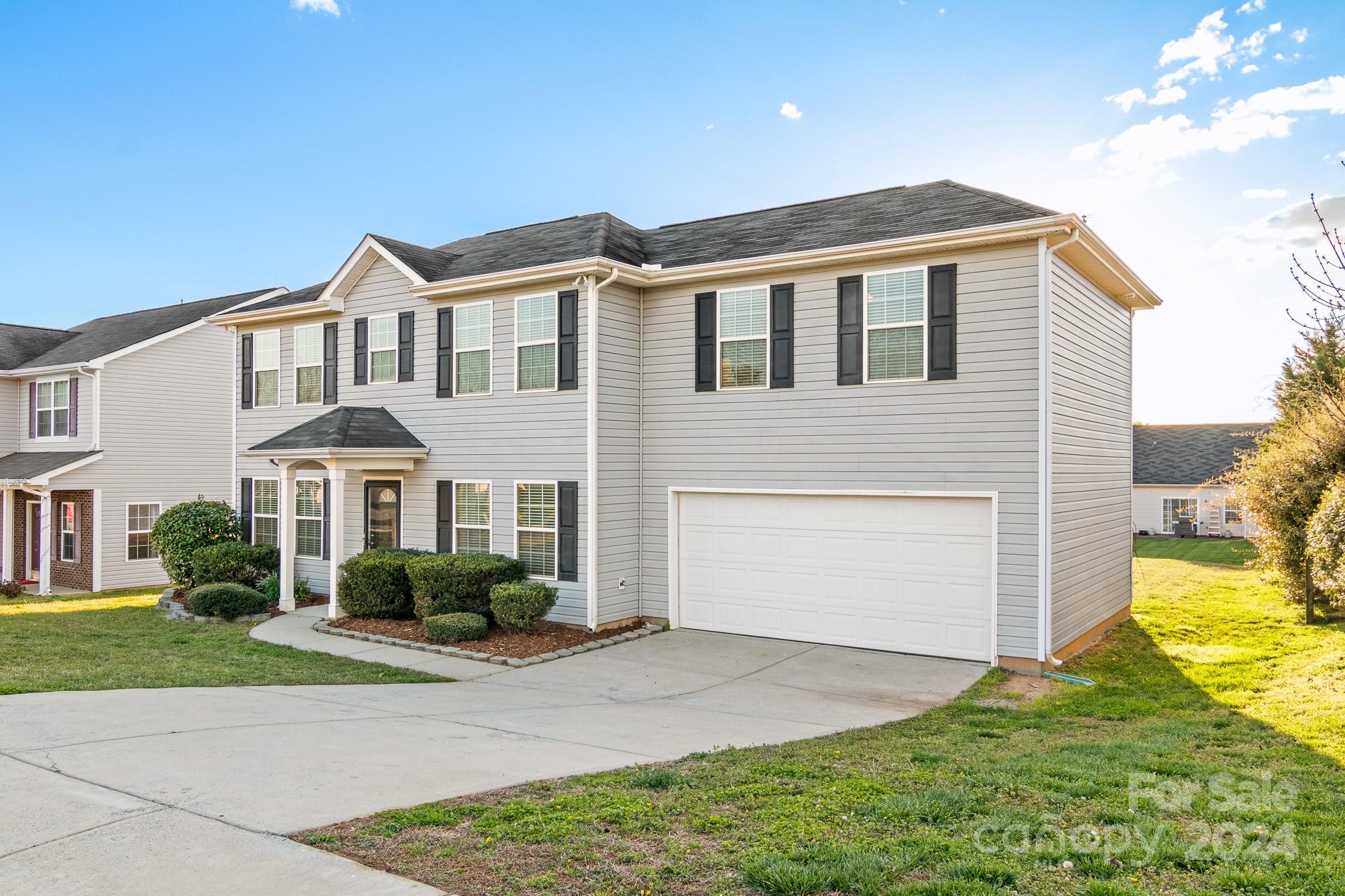 4071 Clover Road Northwest Concord, NC 28027 - Photo 2 of 43 a front view of a house with a yard and garage