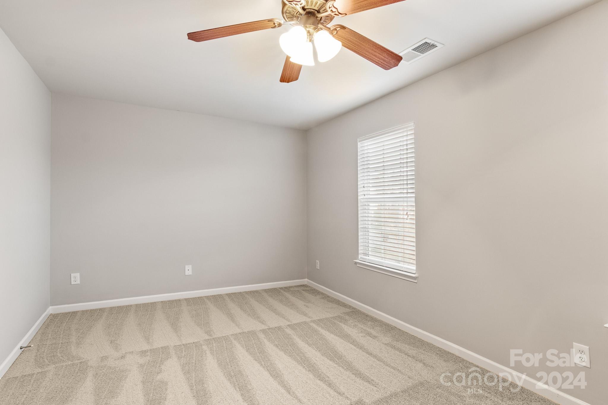 4071 Clover Road Northwest Concord, NC 28027 - Photo 27 of 43 an empty room with windows and fan