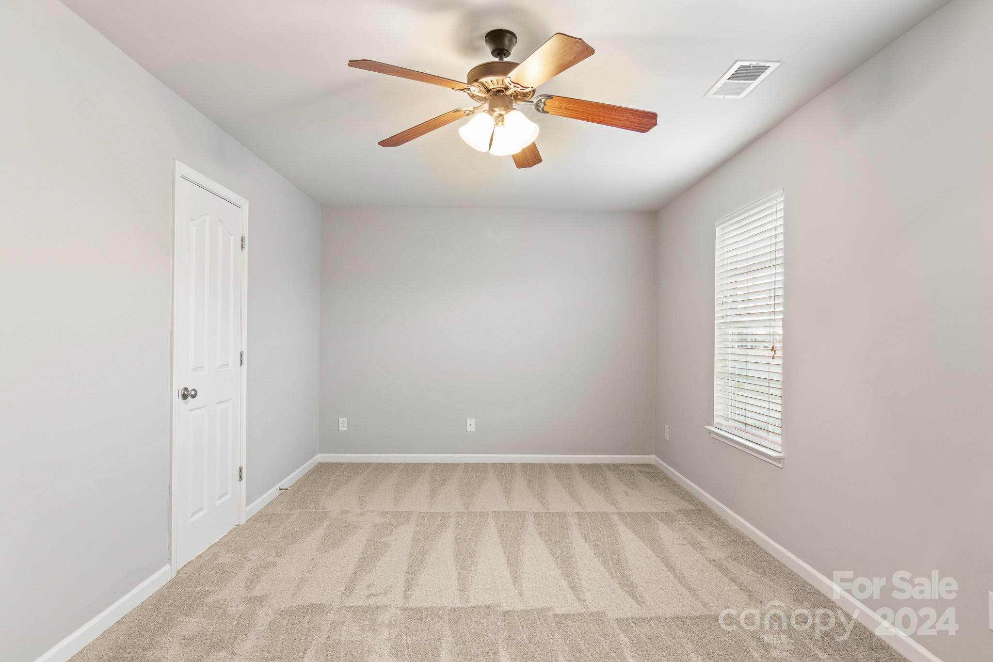 4071 Clover Road Northwest Concord, NC 28027 - Photo 28 of 43 wooden floor in an empty room with a window