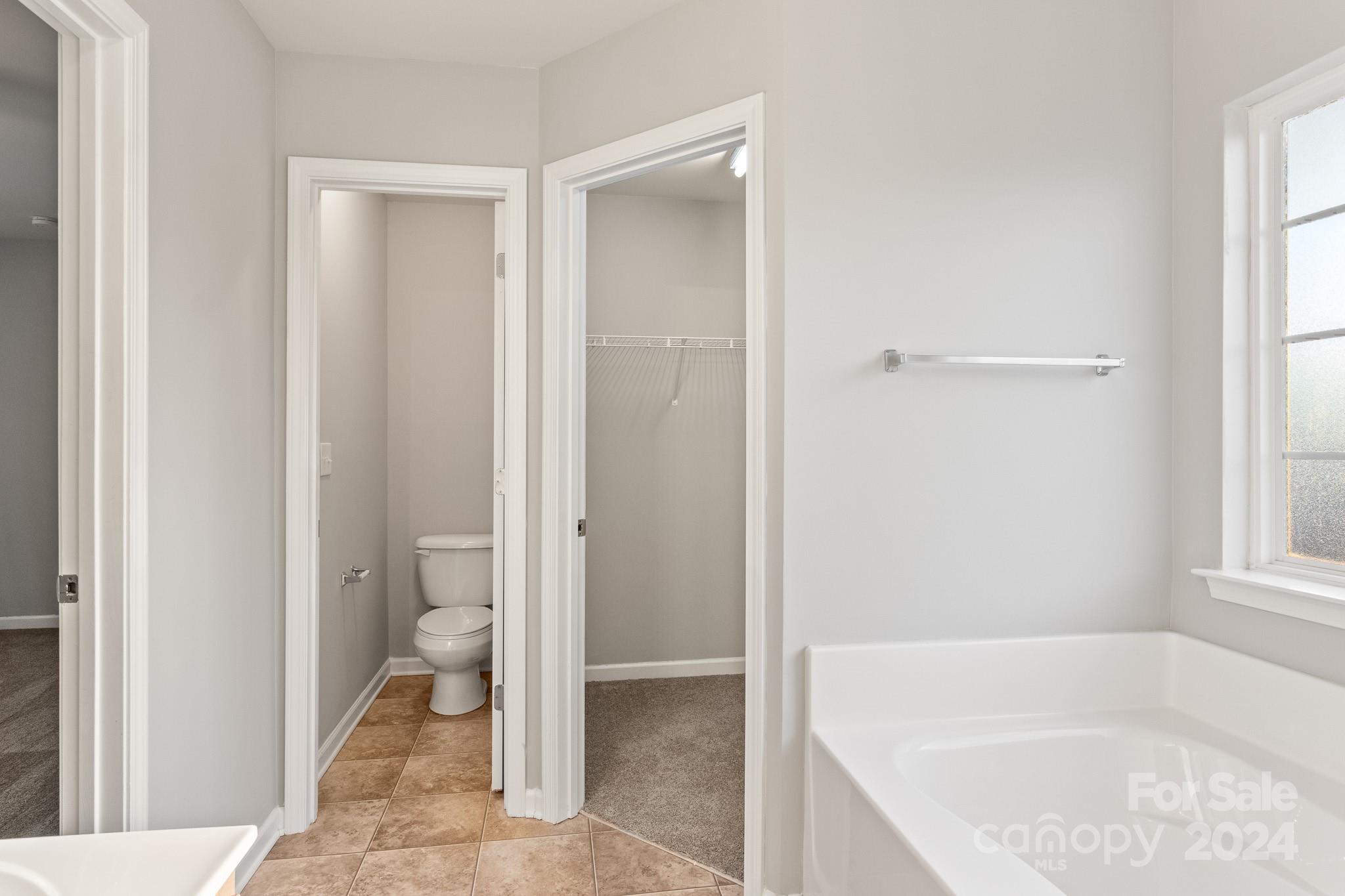 4071 Clover Road Northwest Concord, NC 28027 - Photo 30 of 43 a bathroom with a tub and shower