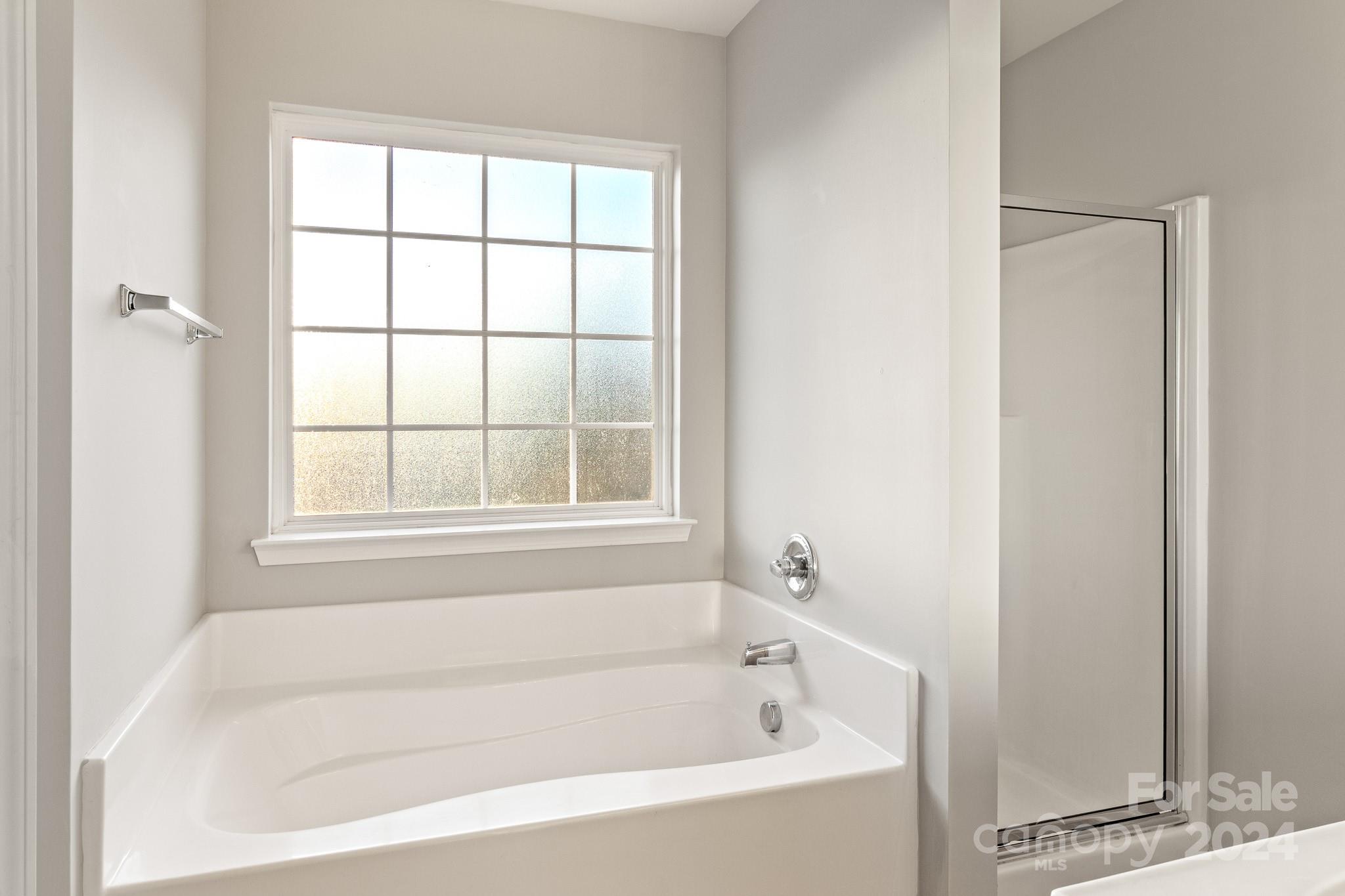 4071 Clover Road Northwest Concord, NC 28027 - Photo 32 of 43 a white bath tub sitting next to a window