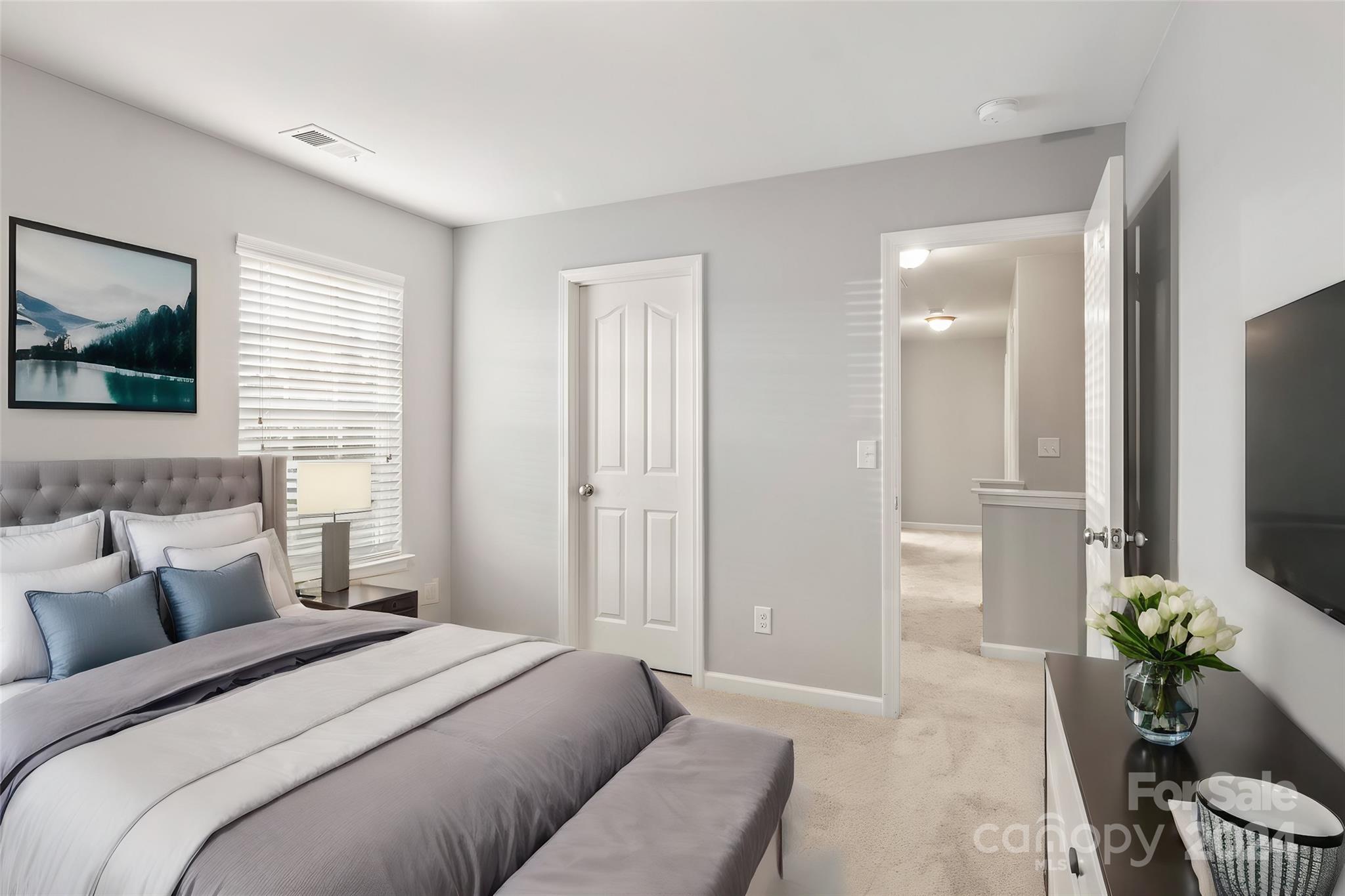 4071 Clover Road Northwest Concord, NC 28027 - Photo 40 of 43 a bedroom with a bed and a flat screen television