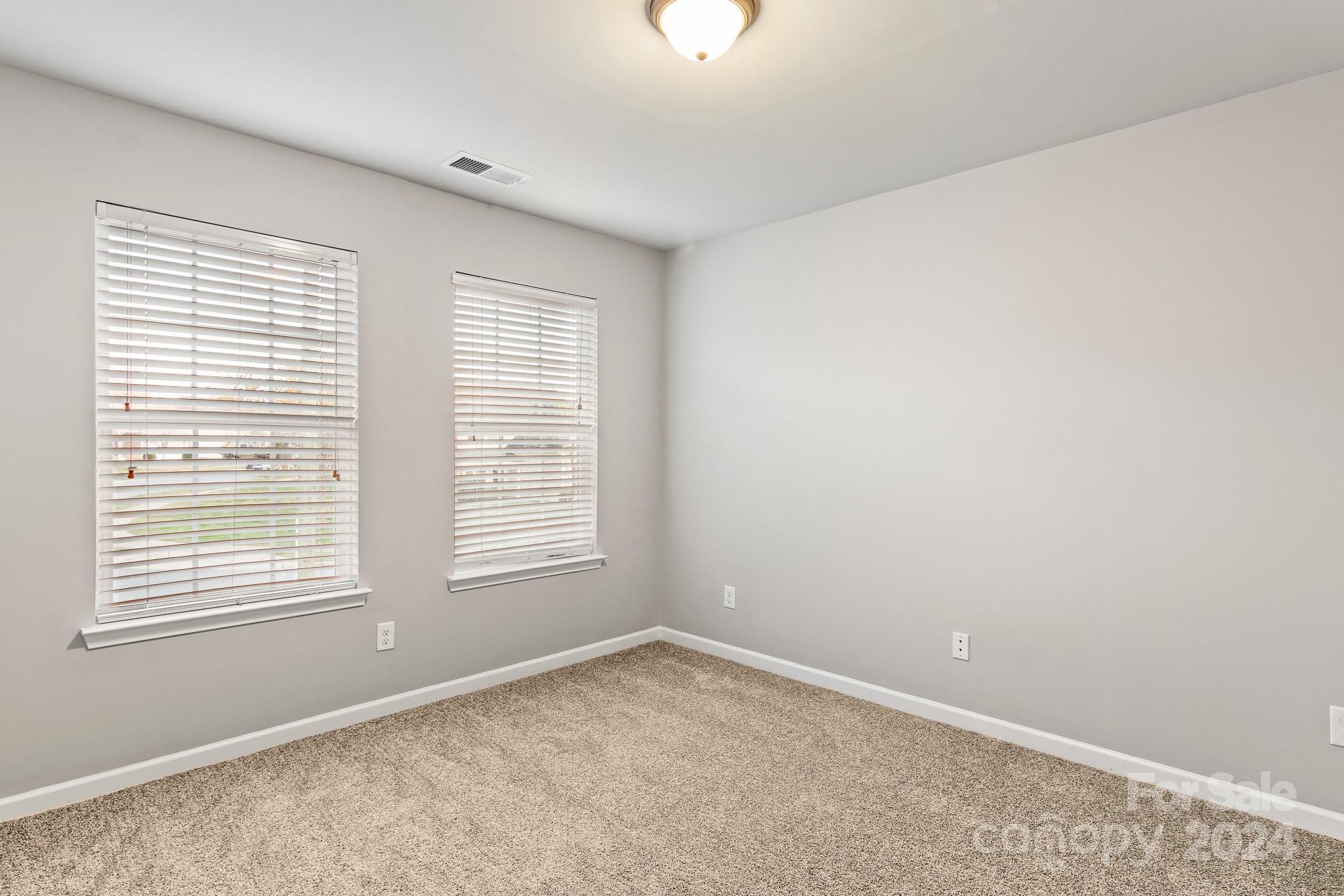 4071 Clover Road Northwest Concord, NC 28027 - Photo 42 of 43 an empty room with a window