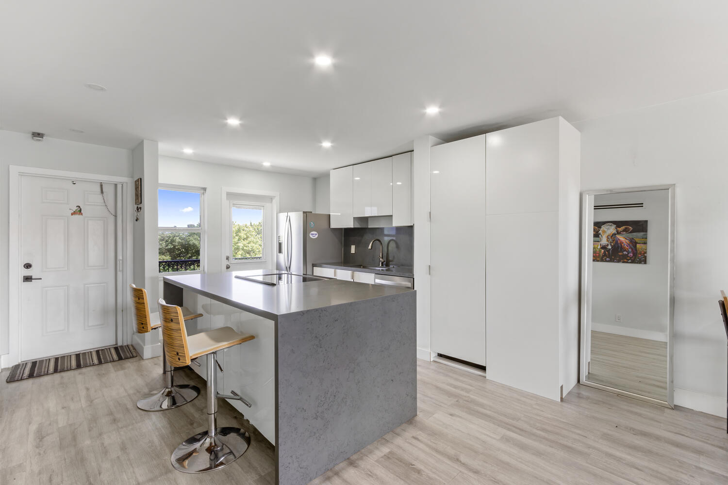 2871 North Ocean Boulevard, Unit V443 Boca Raton, FL 33431 - Photo 7 of 49 a view of kitchen with kitchen island dining table and chairs