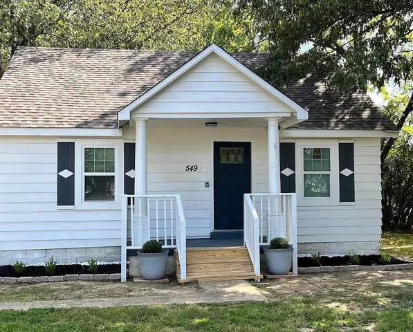 a front view of a house with garage