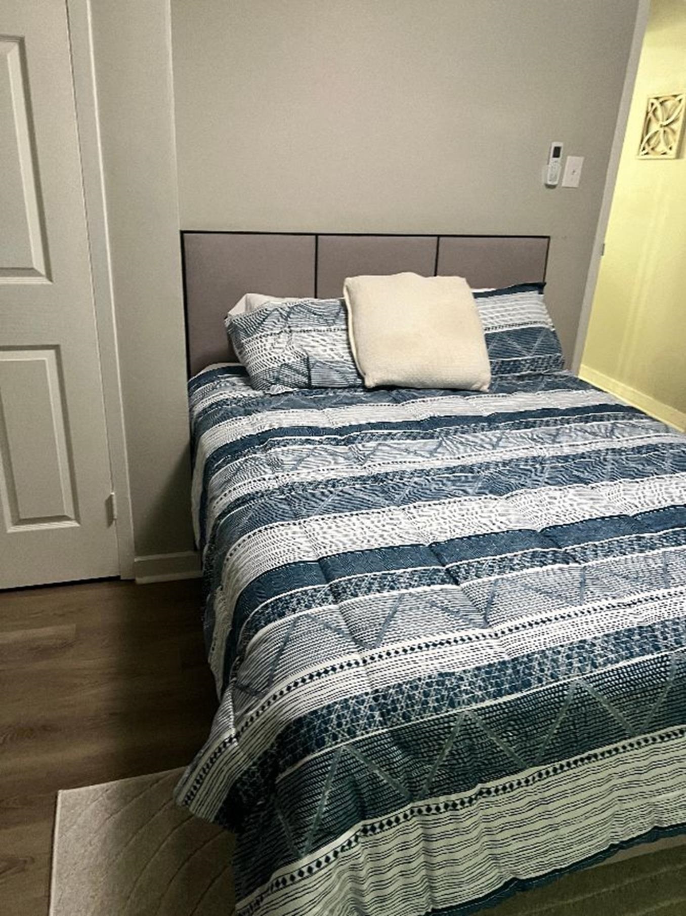 549 South Rowlett Street Collierville, TN 38017 - Photo 11 of 27 a bedroom with a bed and wooden floor