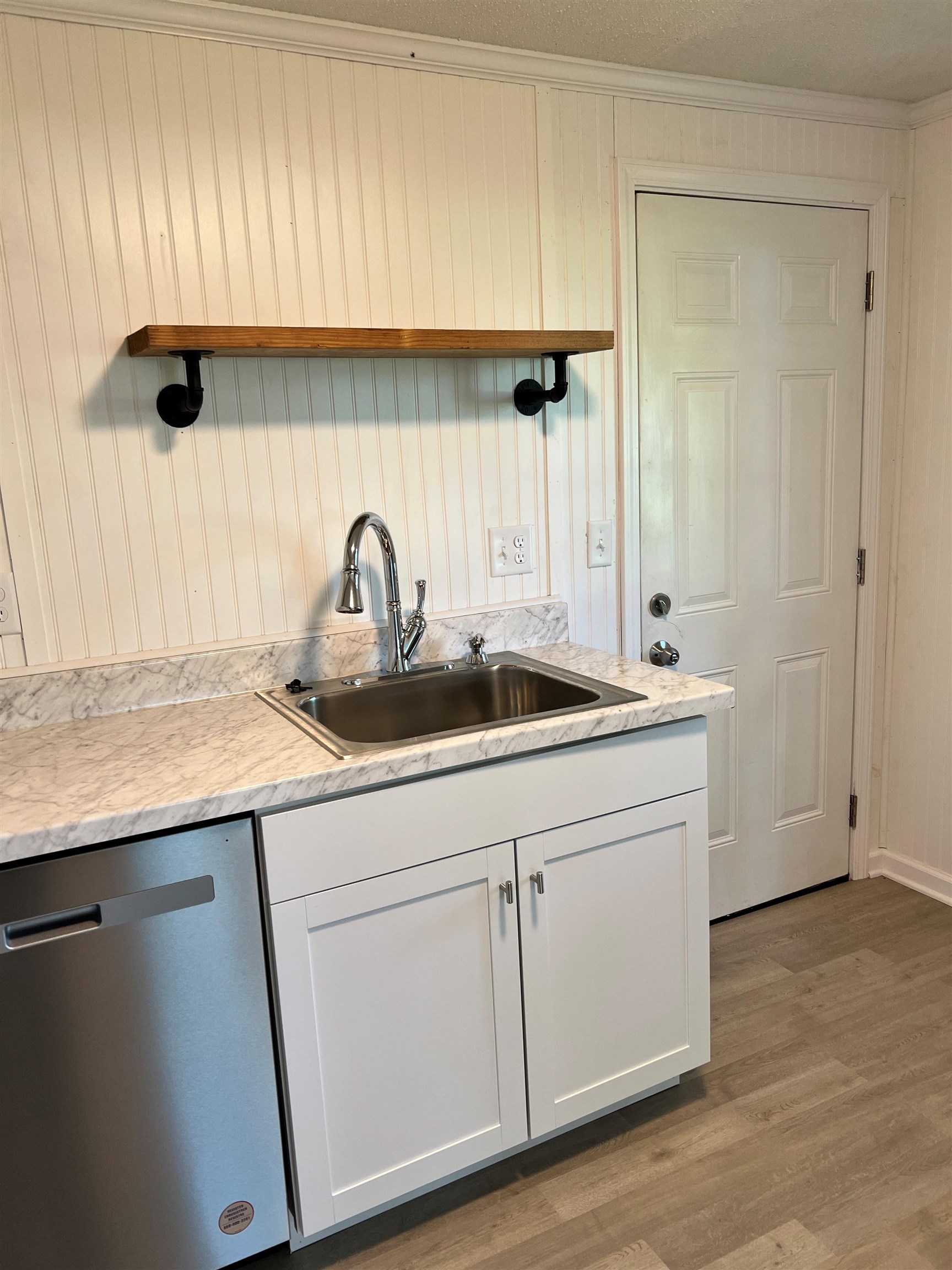 549 South Rowlett Street Collierville, TN 38017 - Photo 17 of 27 a kitchen with a sink and a refrigerator