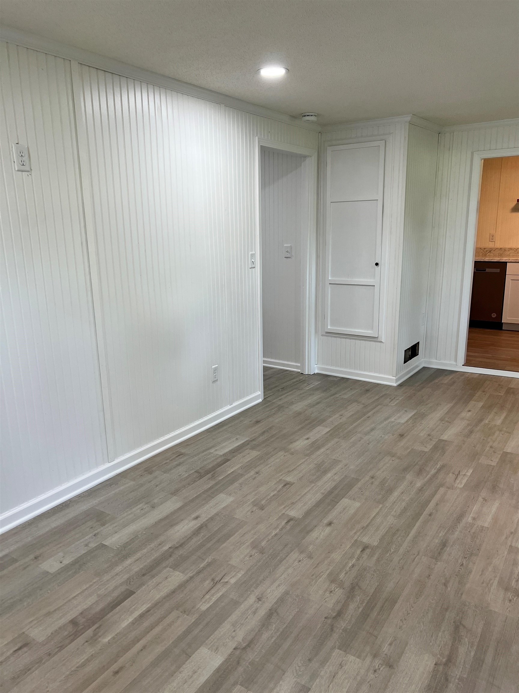 549 South Rowlett Street Collierville, TN 38017 - Photo 21 of 27 a view of an empty room with wooden floor