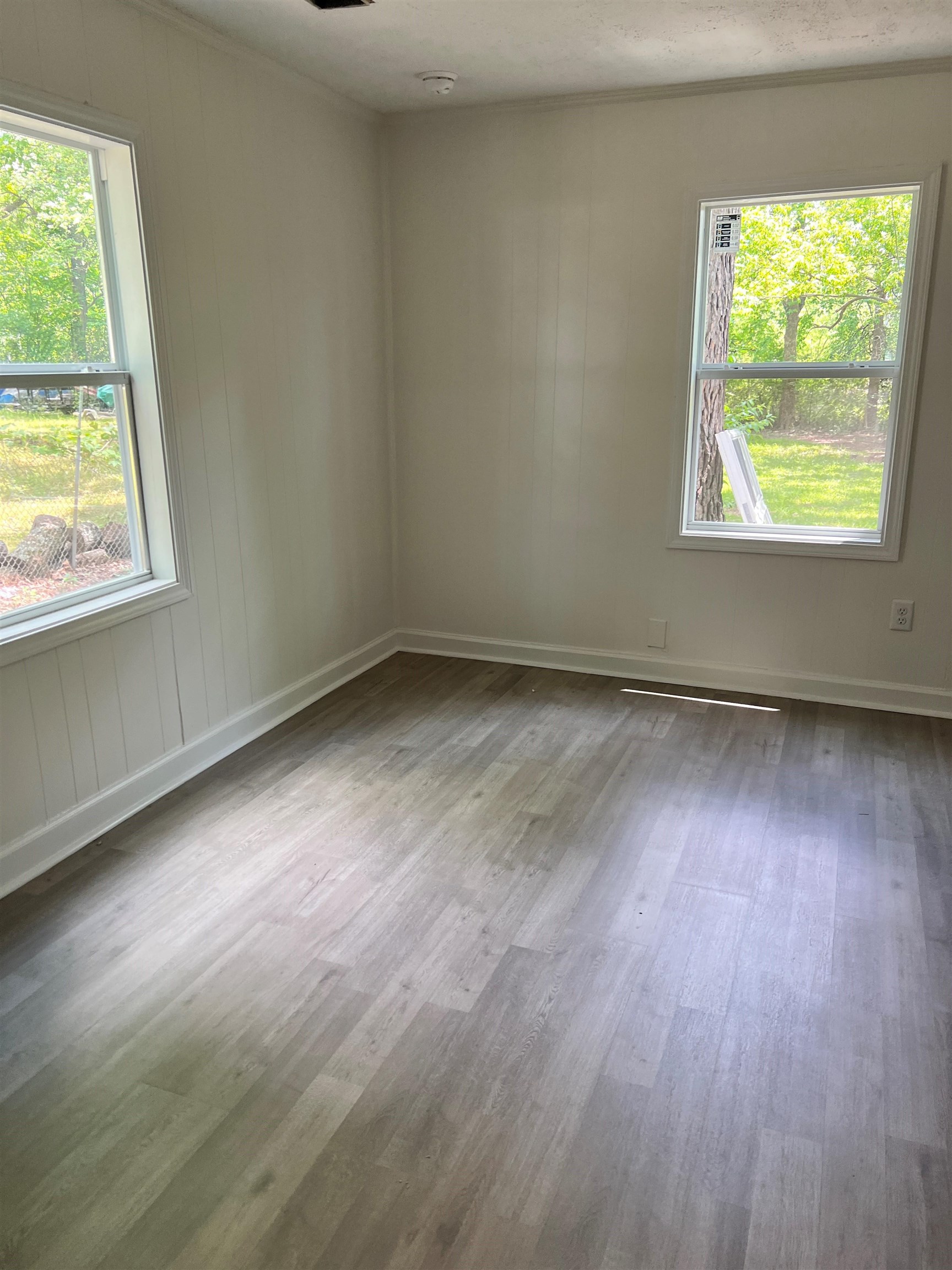 549 South Rowlett Street Collierville, TN 38017 - Photo 22 of 27 an empty room with wooden floor and windows