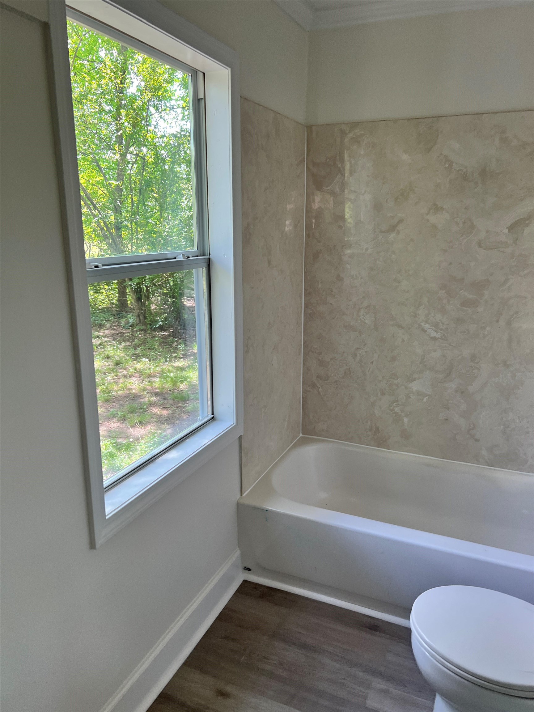 549 South Rowlett Street Collierville, TN 38017 - Photo 24 of 27 a bathroom with a toilet and a bath tub